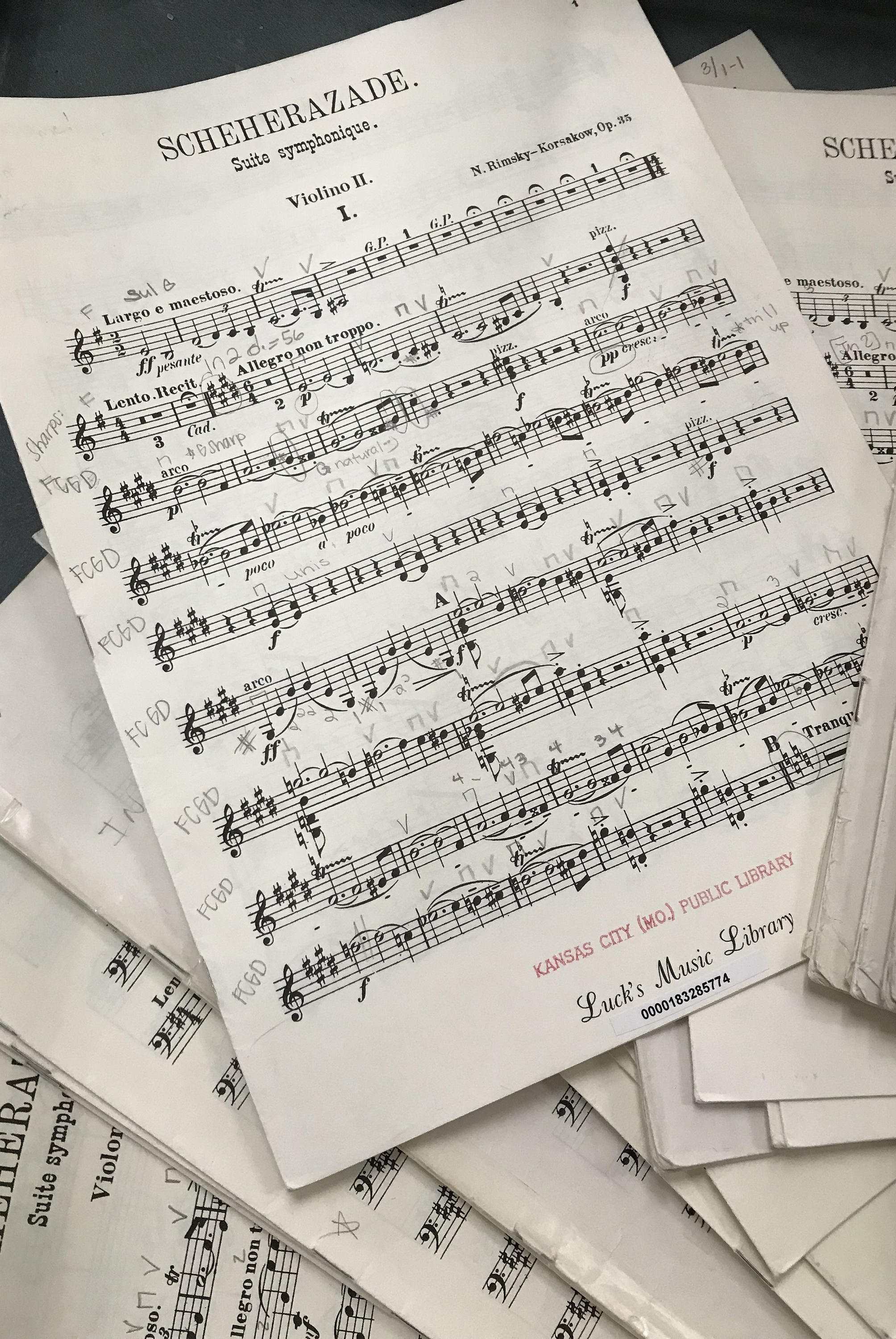 stacks of sheet music on table