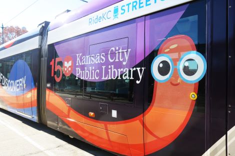 Closeup of the bookworm featured on the side of the Library-themed streetcar