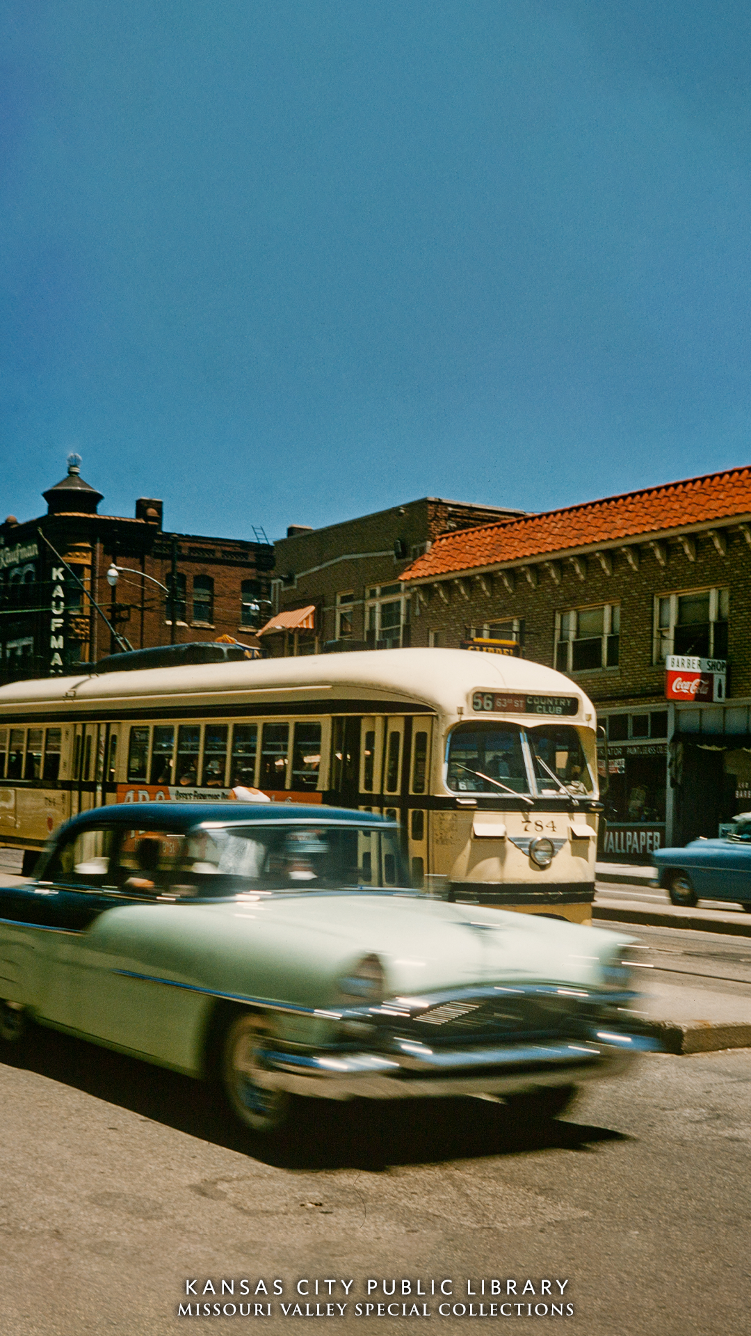 1950s car and streetcar on street