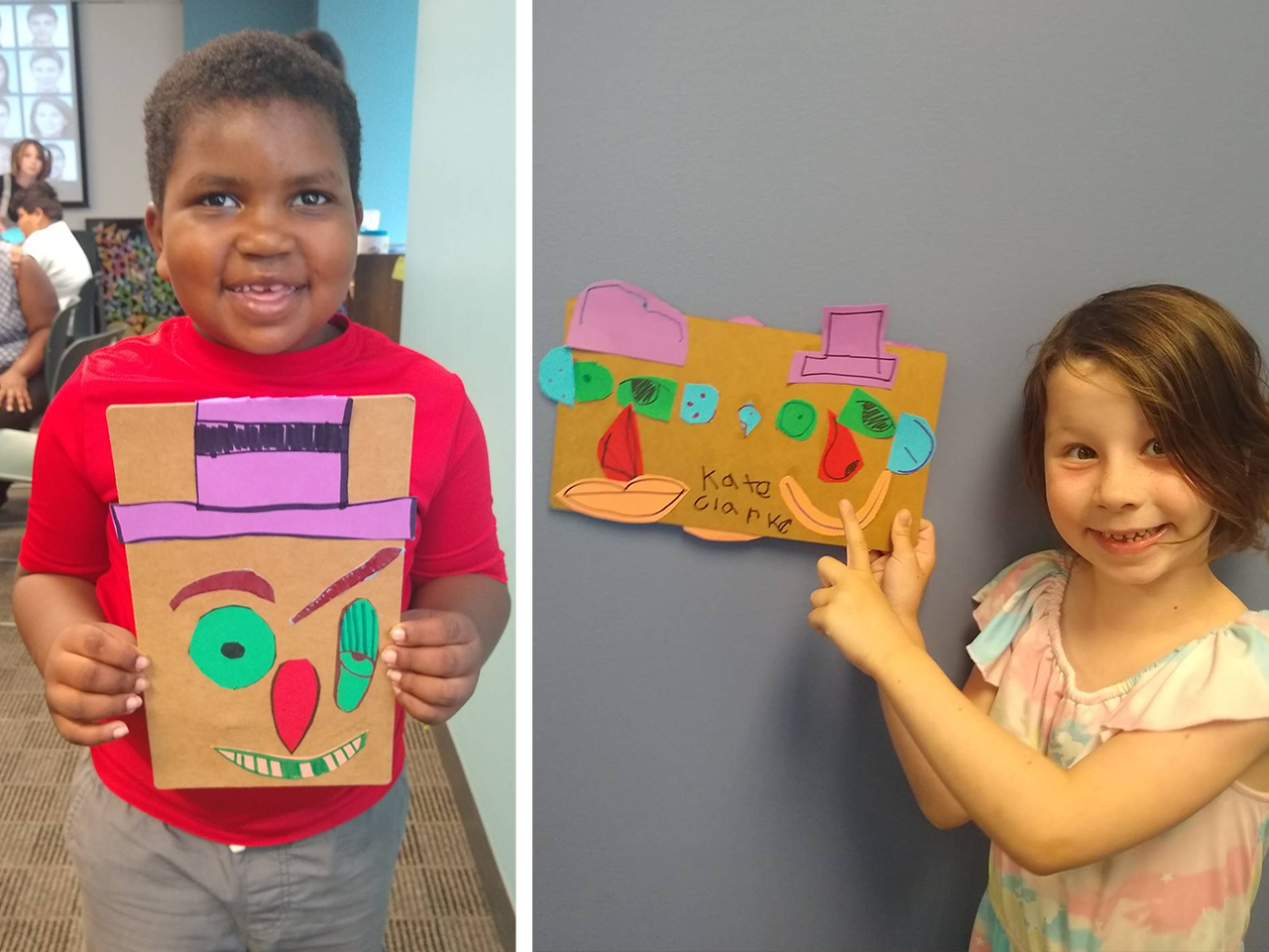 two children smiling with projects