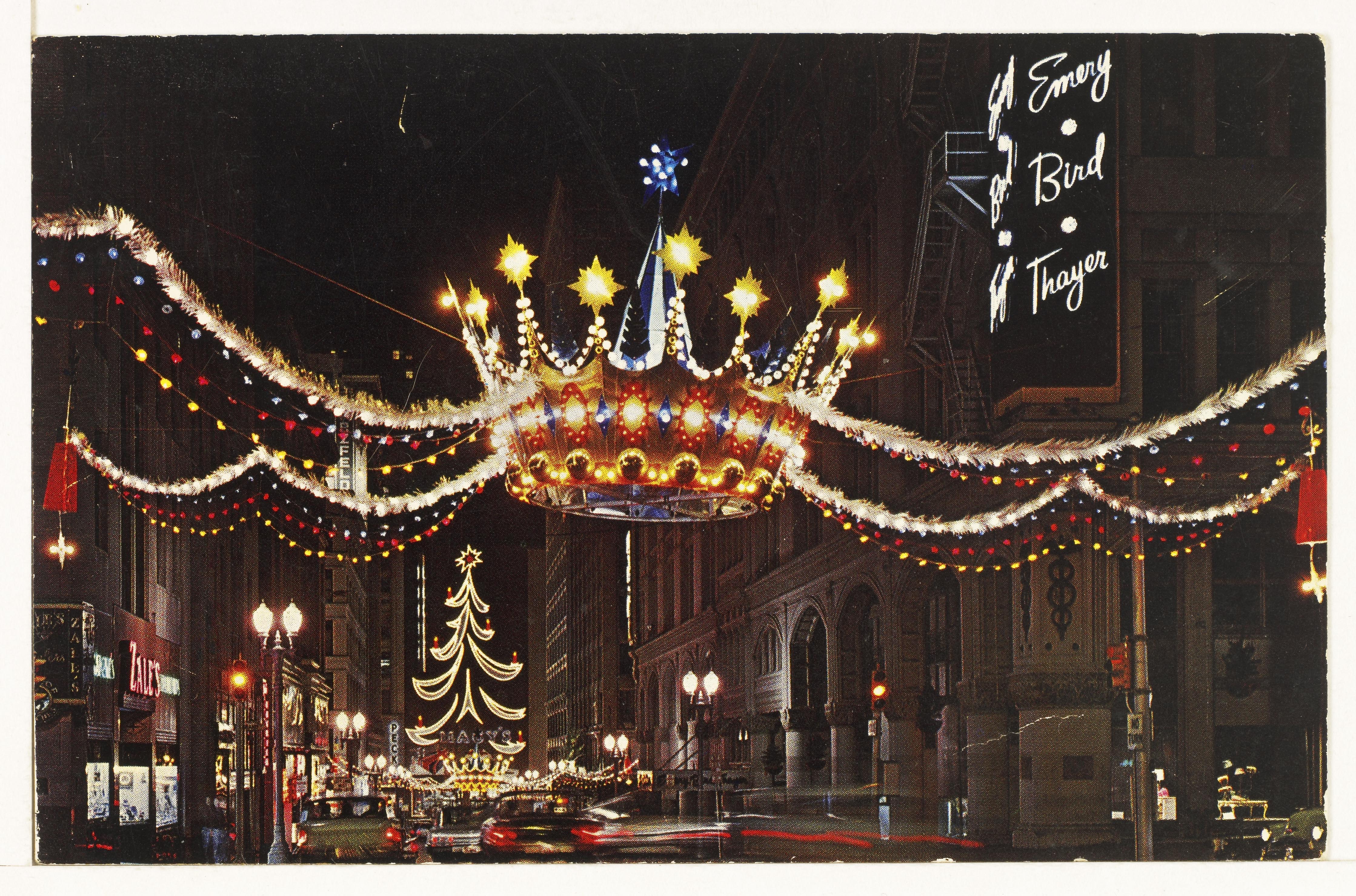 Postcard showing a downtown Christmas crown near the Emery, Bird, and Thayer department store – ca. 1960s