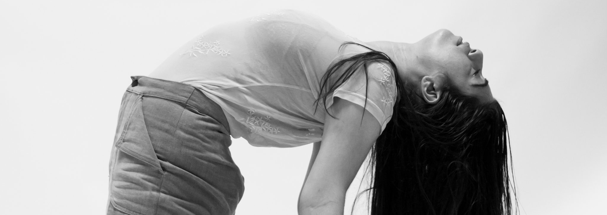 woman bending over backwards in yoga pose