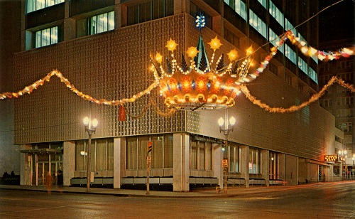 lit crown hanging over streets