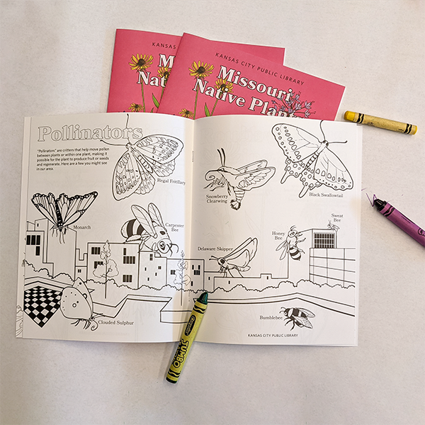 open coloring book with crayons