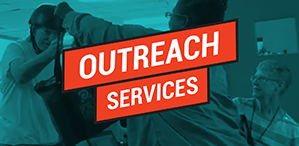 person handing another person a bag with 'Outreach Services'