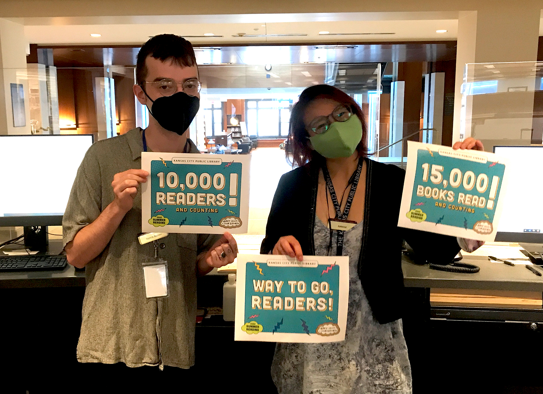 library staff members with signs