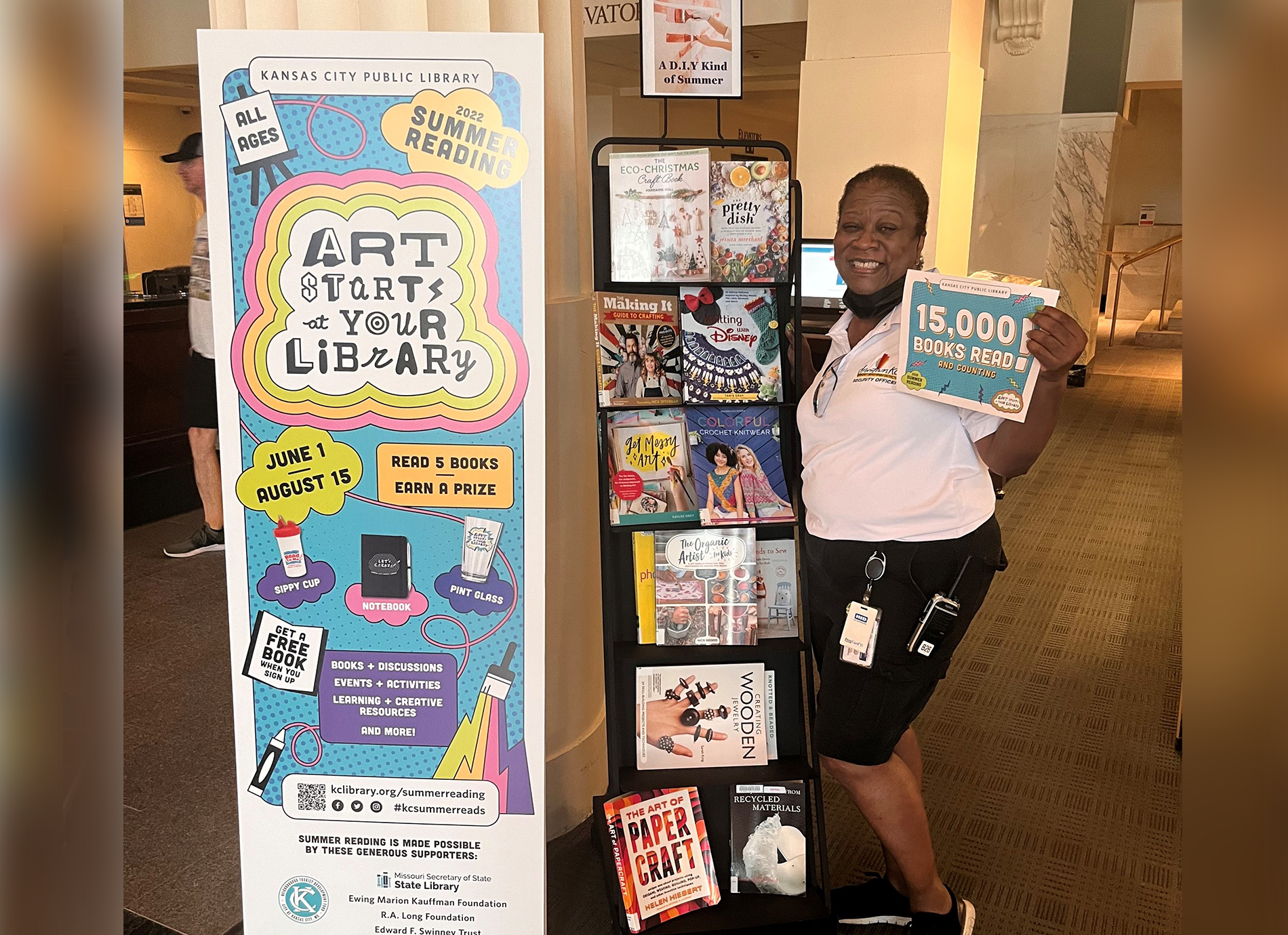 library staff member with sign