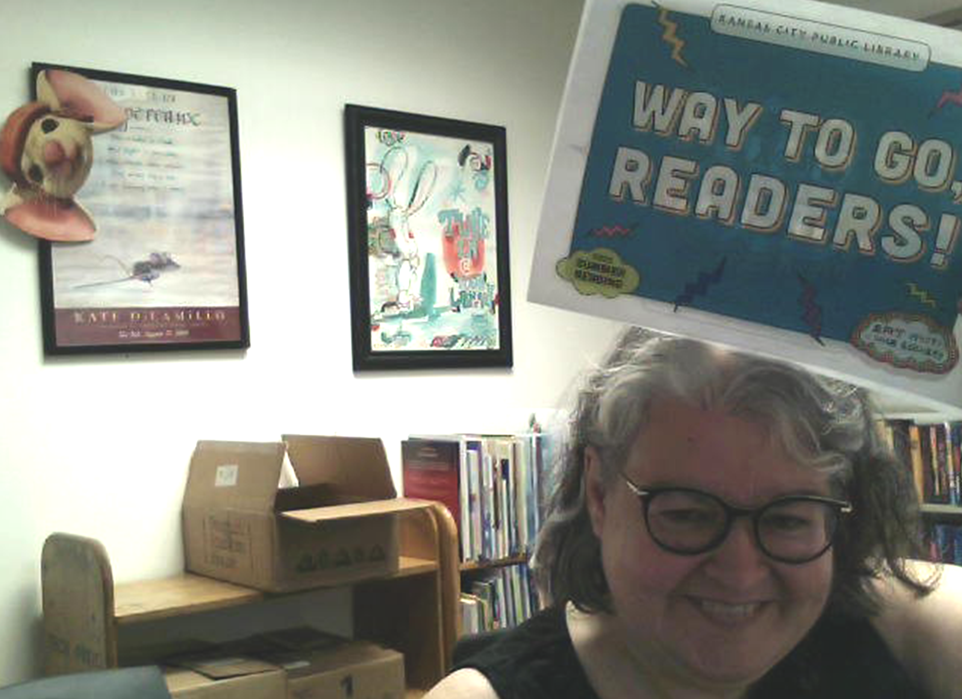 library staff member with sign