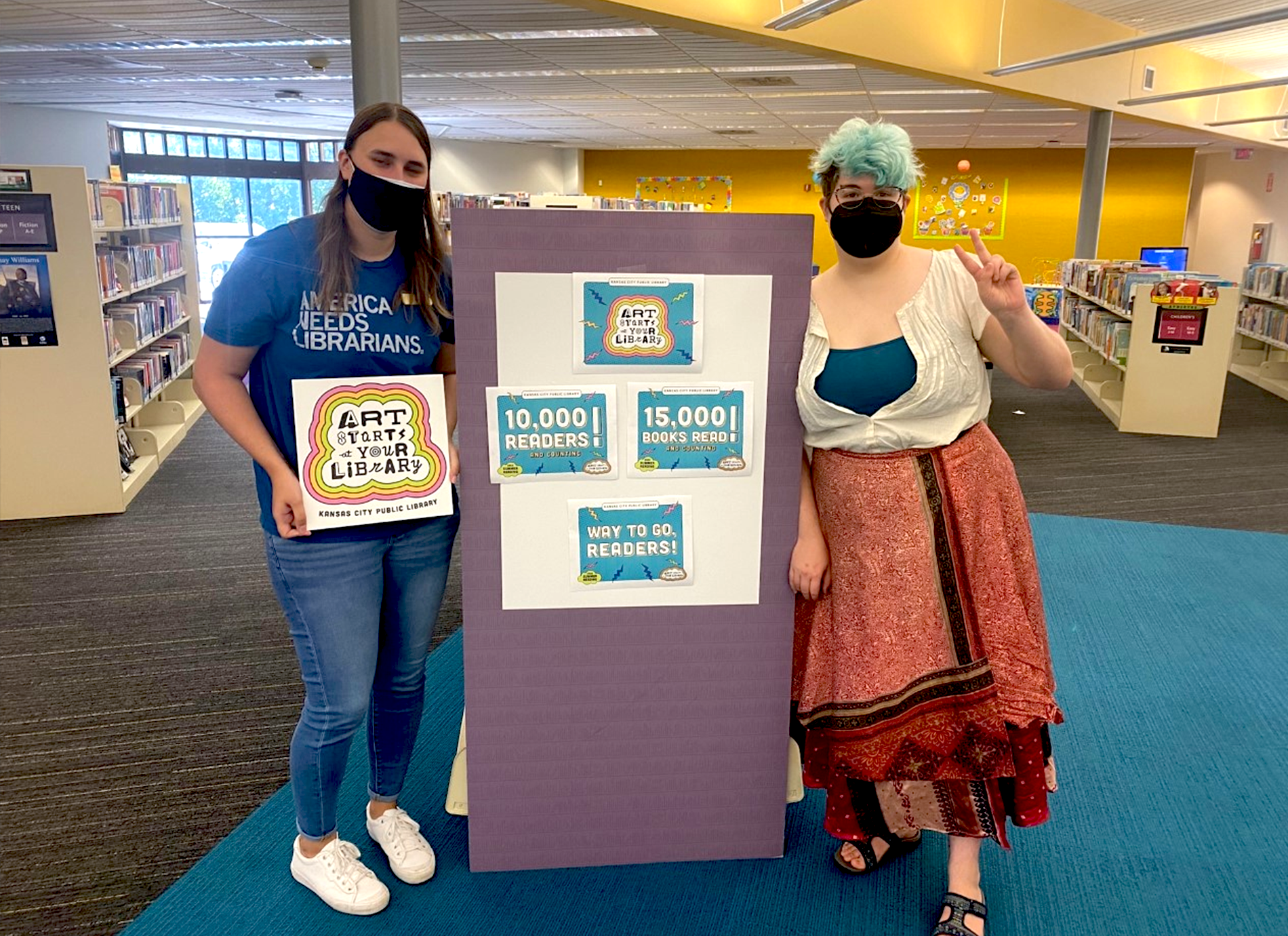 library staff members with signs