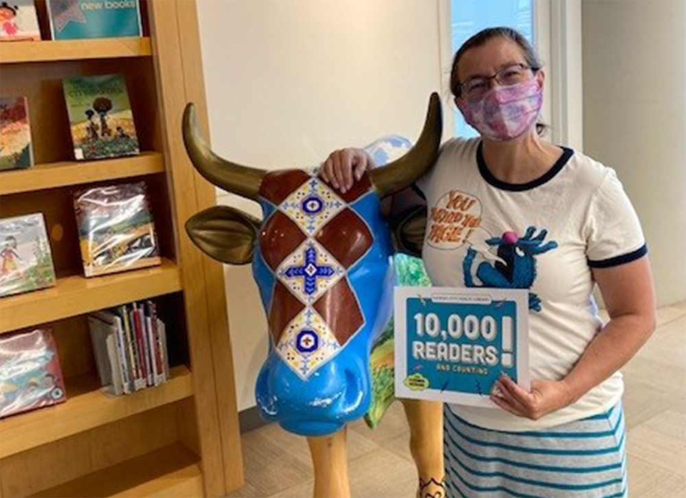 library staff member with sign