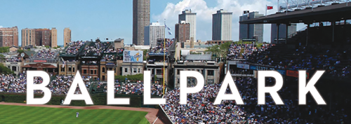 Photo of a crowded baseball stadium with skyline in the background