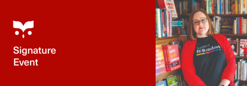 woman stands in front of books