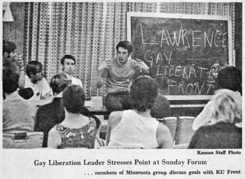 1970s students in front of chalkboard.
