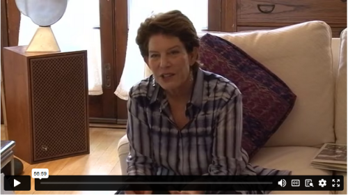 Artist Linda Lighton sits on a couch at home during an interview. 