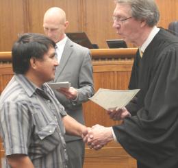 man shaking hands with judge