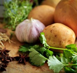 Closeup photograph of vegetables on a wooden counter