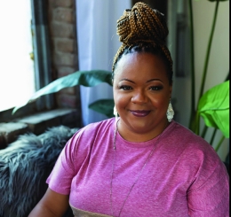 woman sitting down smiling