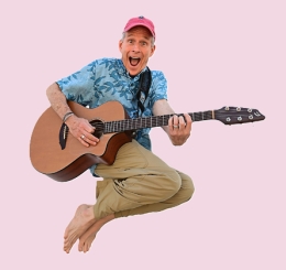 Mr. Stinky Feet jumping with guitar