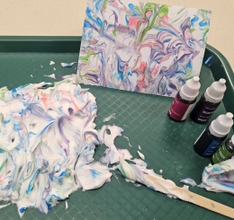 shaving cream, notecard, and food coloring