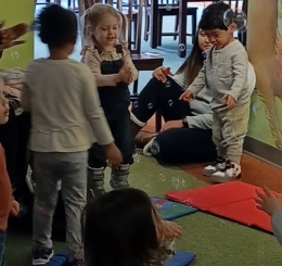 Children playing with bubbles in the library