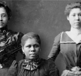Black and white portrait photograph of Five African American women