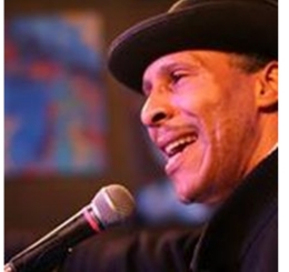 man in hat with microphone