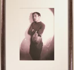 Portrait of Sessue Hayakawa Holding a Helmet