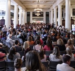 Crowd seated in a large hall