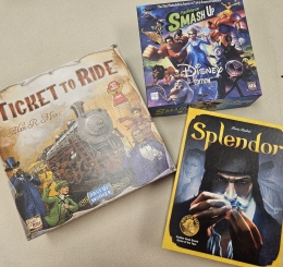 three board game boxes