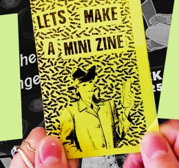 hands holding tiny zine