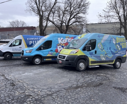 3 mobile service vehicles parked