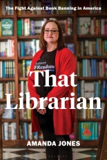 The cover of That Librarian shows Amanda Jones in a red cardigan, standing in front of a shelf of books