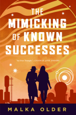 The cover of The Mimicking of Known Successes is burnt orange and yellow, with silhouettes of two women in the bottom - spacey buildings/rockets are in the background, also silhouettes