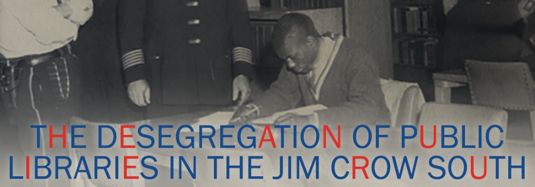 black and white photo of uniformed man at table