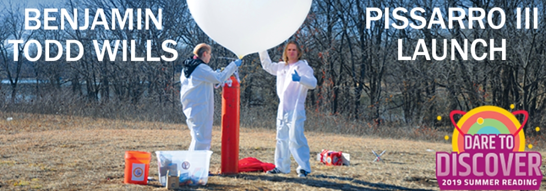 two people fill giant white balloon