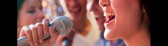 woman sings in microphone