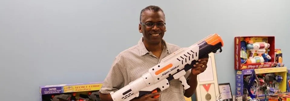 photo of man holding super soaker water gun