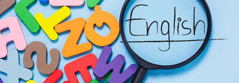 foam letters, magnifying glass, and the word "English"