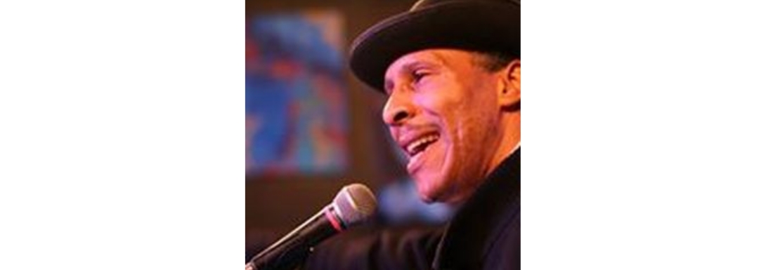 man in hat with microphone