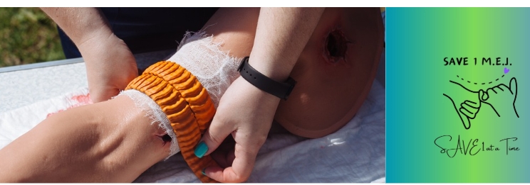 Close up of hands applying a bandage to a wounded arm