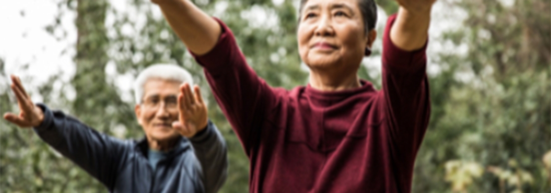 man and woman in tai chi pose