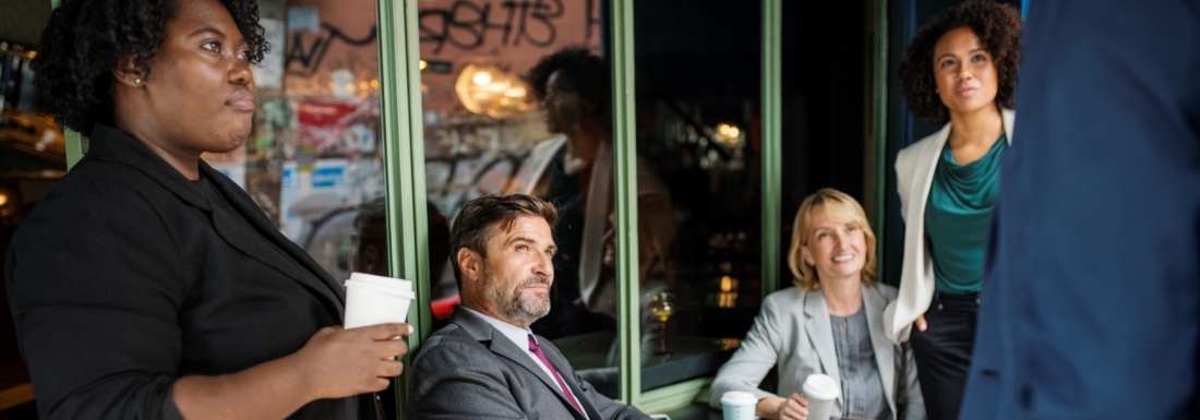 group of five sitting in outdoor bistro