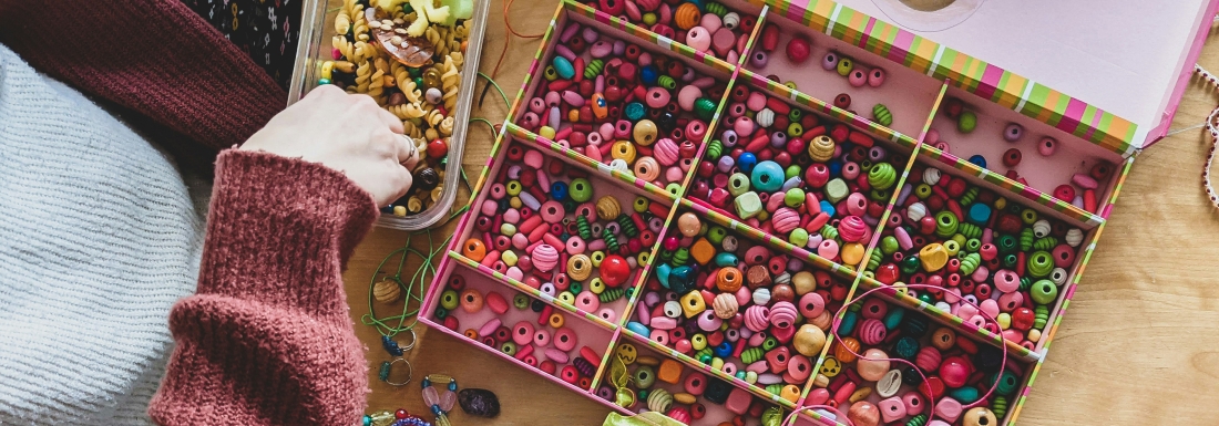 people making bracelets with beads