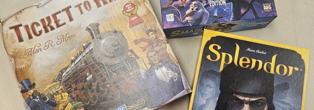 three board game boxes