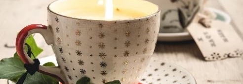 candle in teacup