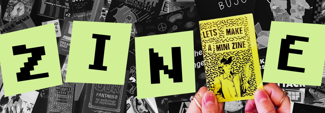 hands holding tiny zine
