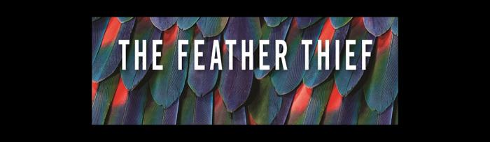 iridescent green feathers with red spots
