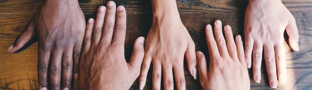 hands on a wooden suface