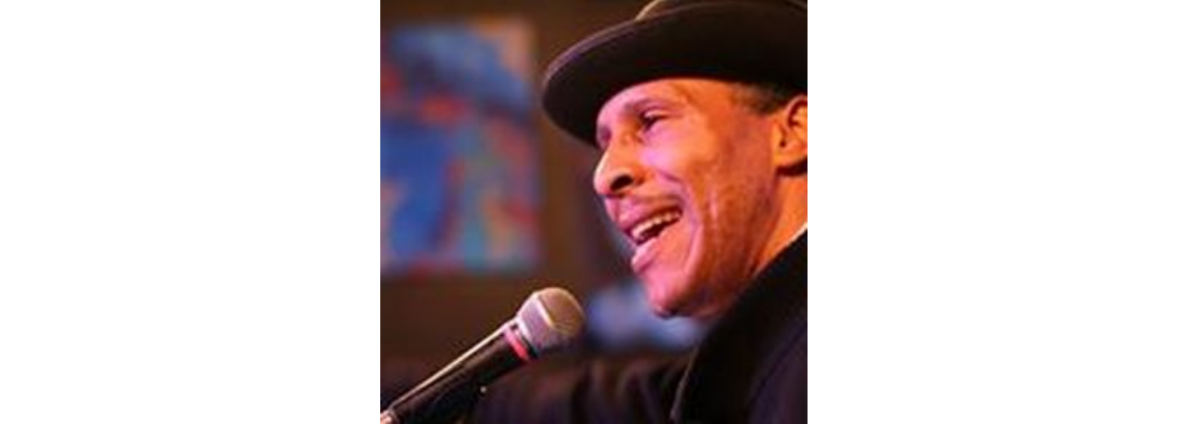 man in hat with microphone