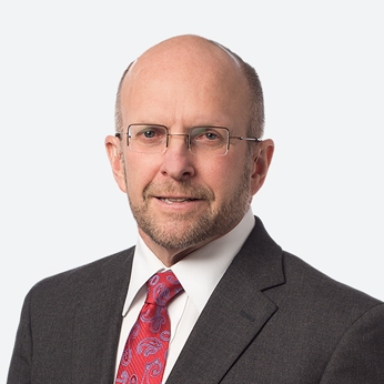 man with glasses in suit